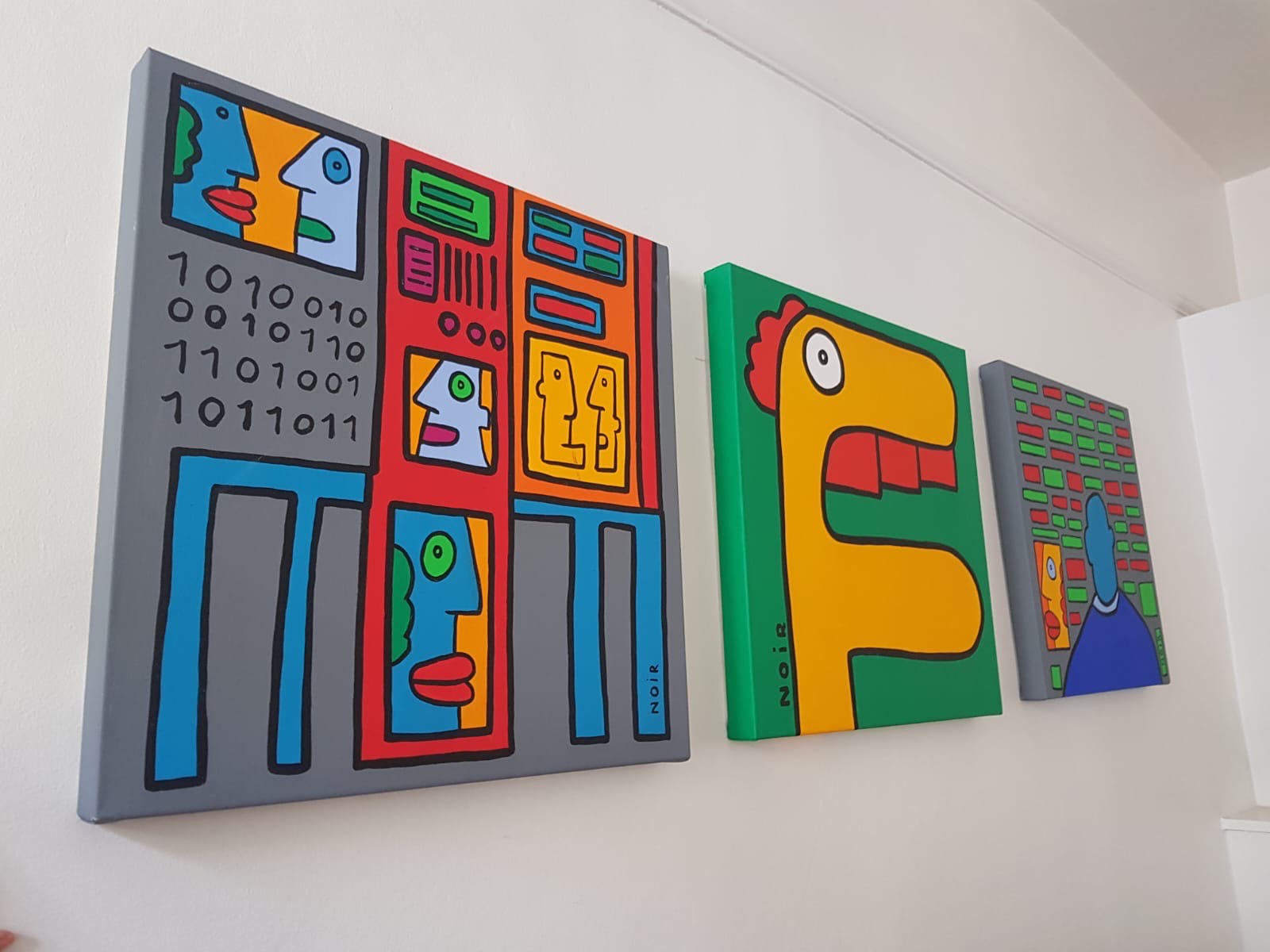Colorful abstract artwork by Thierry Noir featuring vibrant, bold lines and shapes on a canvas.