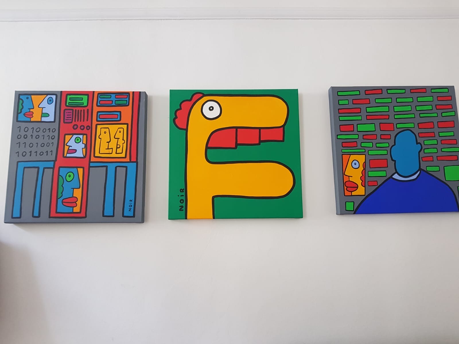 Colorful Thierry Noir street art mural painting on a wall, showcasing vibrant urban artwork by Thierry Noir.