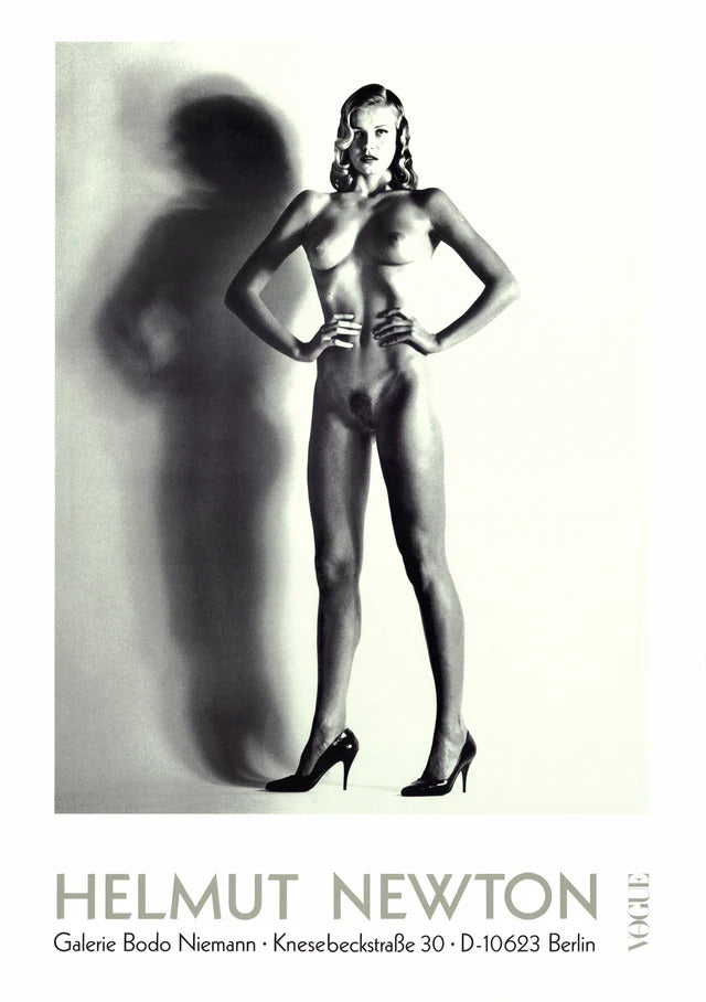 Close-up of a large nude photograph by Helmut Newton, showcasing a black-and-white artistic image with bold contrasts.