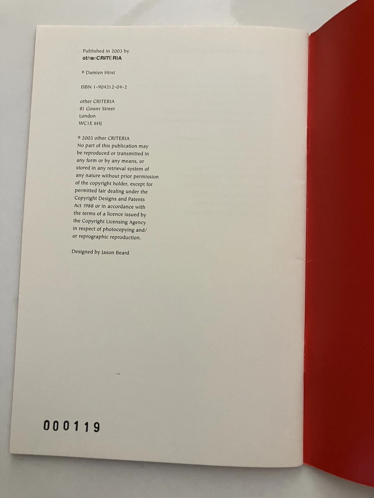 Self-portrait of a smiley face artwork by Damien Hirst, featuring vibrant colors and distinct artistic style.